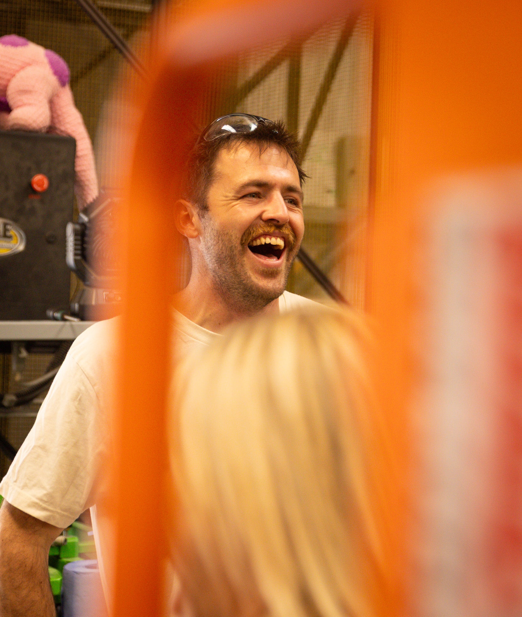 Brewer laughing at a brewery, behind the scenes of the Brewser craft beer subscription
