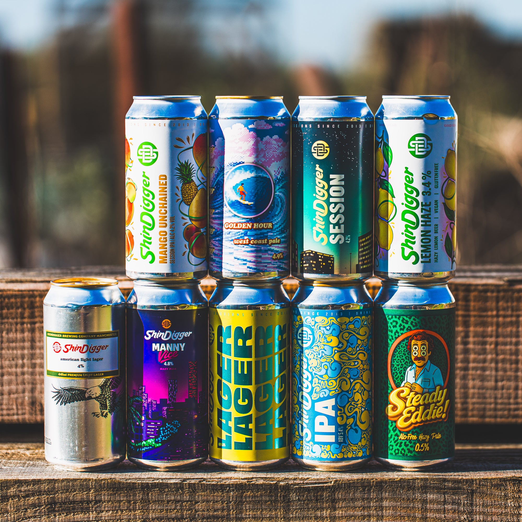 ShinDigger Brewery full can lineup including Mango Unchained, Lager, Session IPA and Steady Eddie, available in a Brewser box