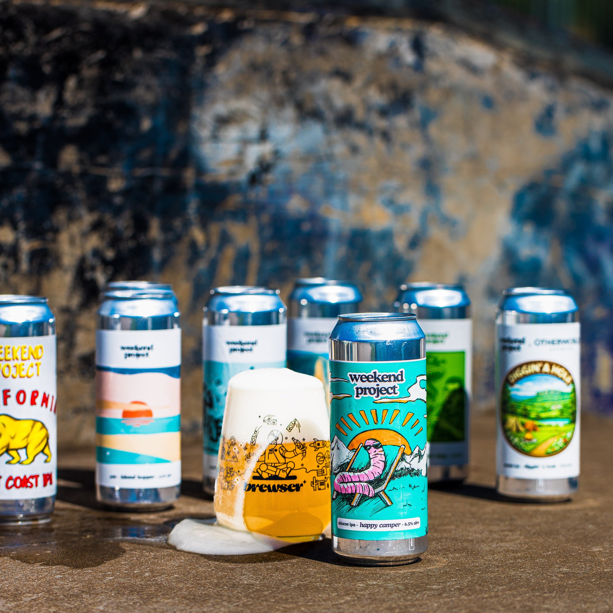 Weekend Project craft beer can lineup with Brewser glass including Happy Camper IPA and California Coast IPA, Brewser subscription box