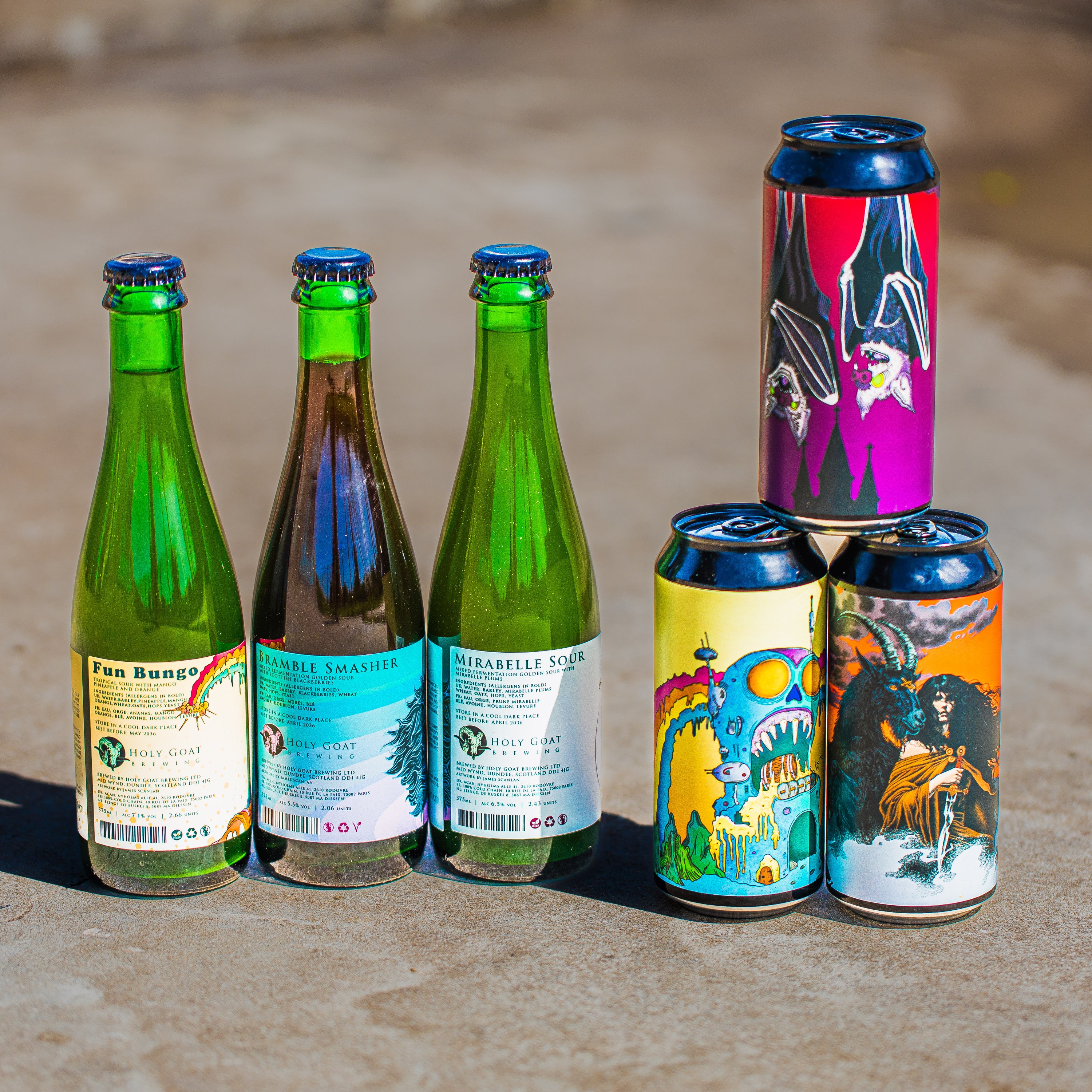 Holy Goat Brewing sour bottles alongside illustrated craft beer cans, Brewser craft beer subscription box contents
