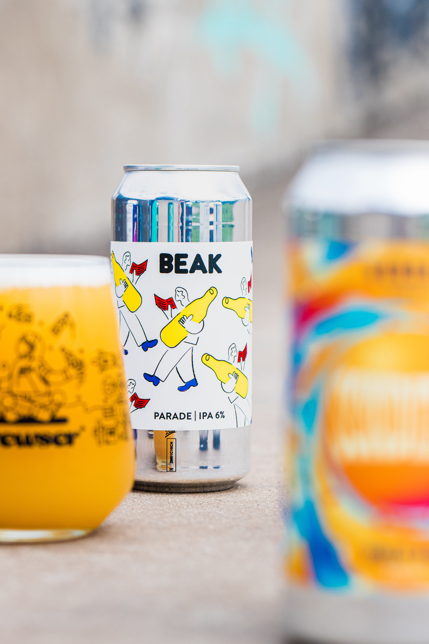 Beak Brewery Parade IPA can with blurred glass and can behind, Brewser craft beer subscription