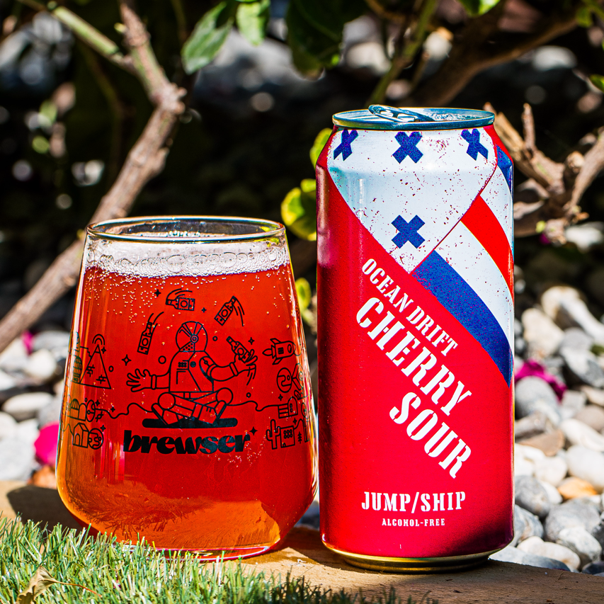 Jump Ship Brewing Ocean Drift Cherry Sour alcohol-free can with a poured Brewser glass, craft beer subscription