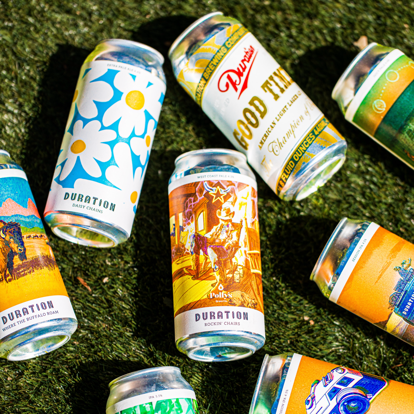 Duration Brewing can lineup on grass including Daisy Chains, Rockin' Chairs and Good Times, Brewser subscription box