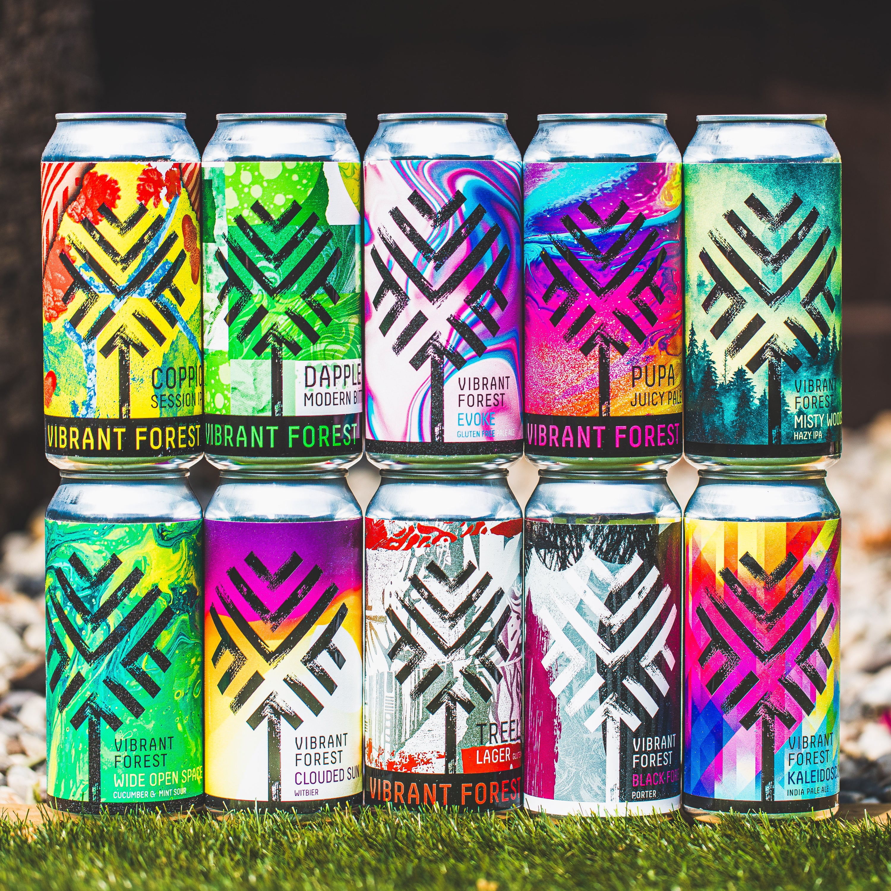 Vibrant Forest can lineup on grass including Pupa Juicy, Misty Woods and Black Forest Porter, Brewser subscription box