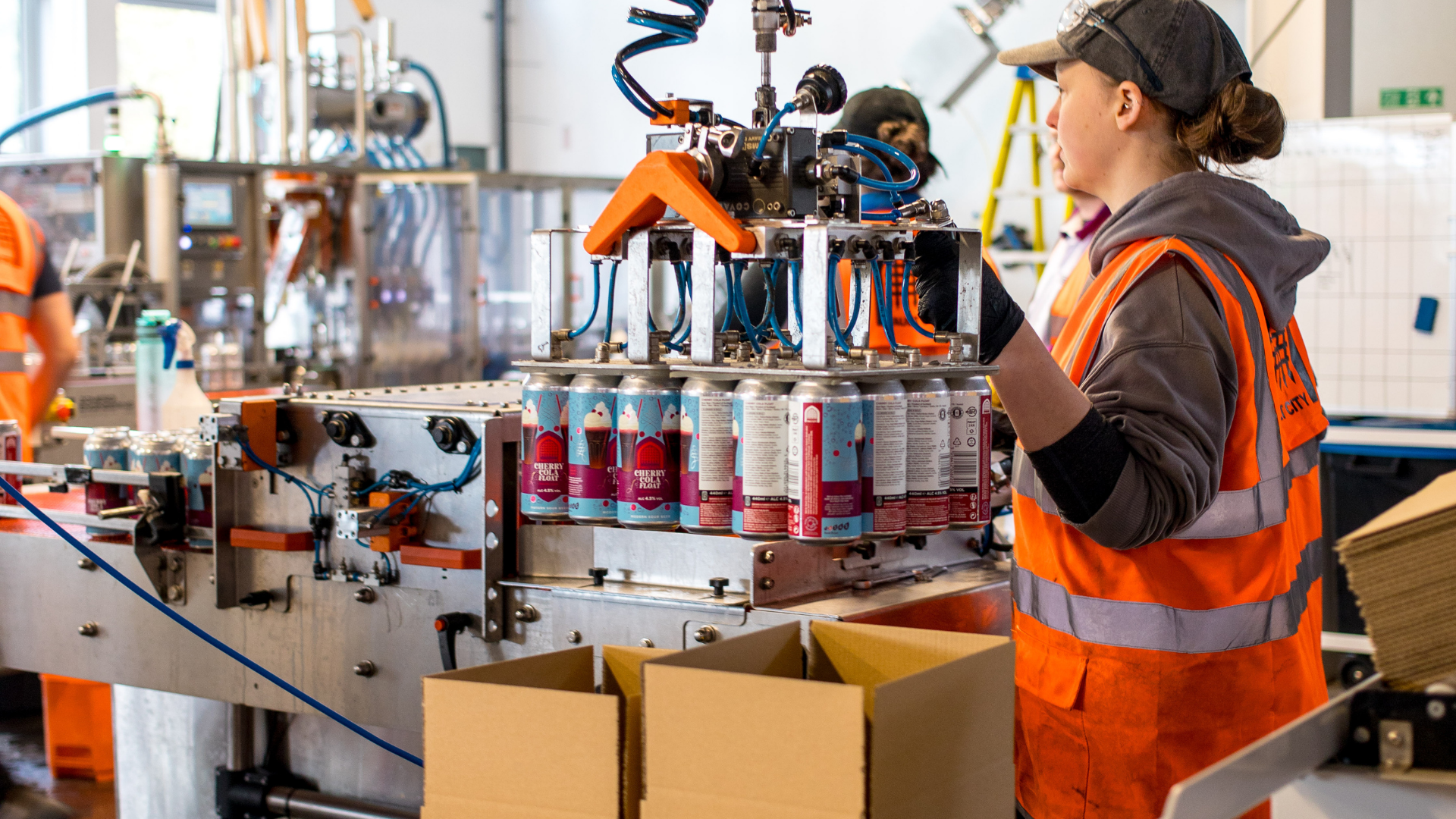 Brewery canning line with Cherry Cola Float Pastry Sour cans being packaged, Brewser craft beer subscription production
